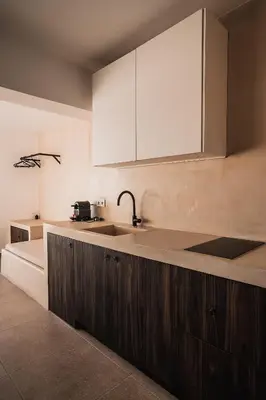 a kitchen with a sink and a counter top at Suites with magical view & jacuzzi in Athens