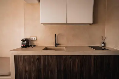 a kitchen with a sink and a counter top at Suites with magical view & jacuzzi in Athens
