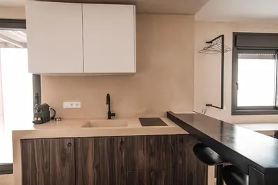 a kitchen with a sink and a counter top at Suites with magical view & jacuzzi in Athens