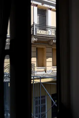 a view from a window of a building with a balcony at Central Calm Apartment in Athens