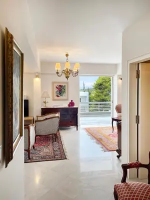 a living room with a piano and a living room at Blue Bay Vouliagmeni Luxury Apartment in Athens