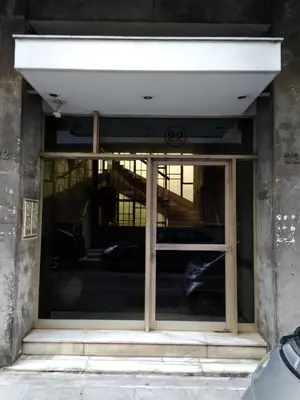 a window of a building with cars in it at flower apartment-Hilton-US embassy in Athens