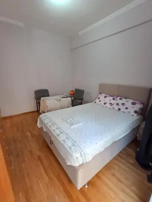 a bedroom with a bed and two chairs in it at flower apartment-Hilton-US embassy in Athens