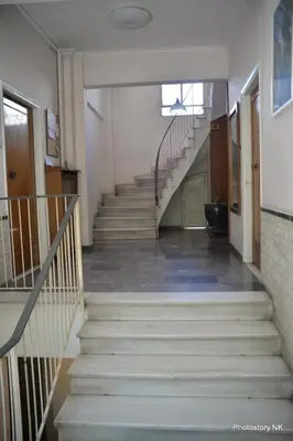 a stairway in a building with a bunch of stairs at kynosargous square's apartment in Athens