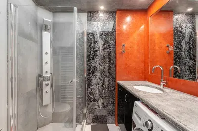 a bathroom with a shower and a toilet and a sink at Filoxenia MG Projects Near Acropolis Veeikou in Athens