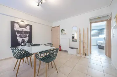 a dining room with a table and two chairs at Luxury Loft with a Balcony by CloudKeys in Athens