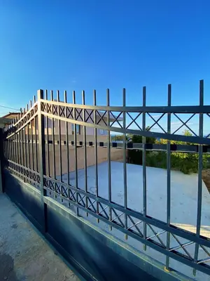 a fence on top of a bridge at The Dona House in Vaia