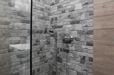 a stone wall with a face on it at Gorgeous 1BR Apartment in Kolonaki by UPSTREET in Athens