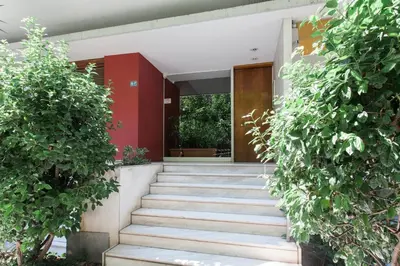 a staircase leading up to a building with plants at Gorgeous 1BR Apartment in Kolonaki by UPSTREET in Athens