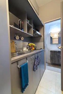 a kitchen with a sink and a counter with towels at jack daniel's appartment in Athens