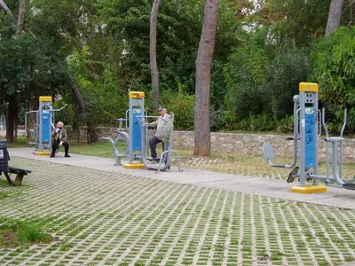 a man is at a bus station at a park at Work or Vacation in shared apartment in Athens