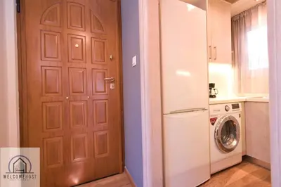 a door to a kitchen with a washing machine at Bright & Restful! in Athens