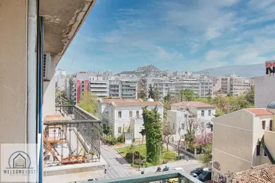a view of a city from the balcony of a building at Bright & Restful! in Athens