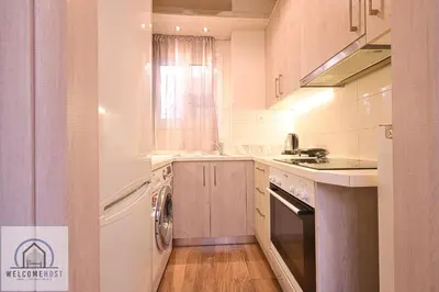 a kitchen with a washer and a sink and a dishwasher at Bright & Restful! in Athens