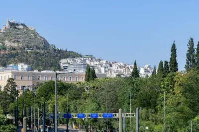 a view of a city with a mountain at Lush Sapphire apt steps from Acropolis & Plaka! in Athens