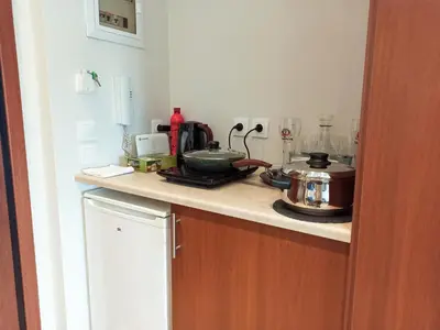 a kitchen with a counter top with a pot on it at Pipinou Studio in Athens
