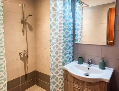 a bathroom with a sink and a shower at Pipinou Studio in Athens