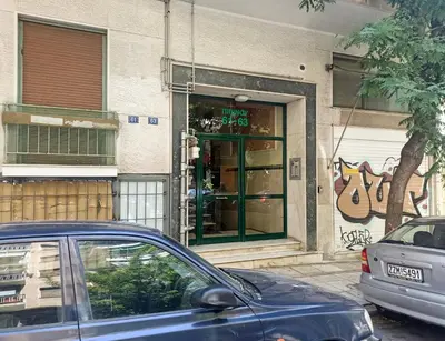 a car parked in front of a store front at Pipinou Studio in Athens
