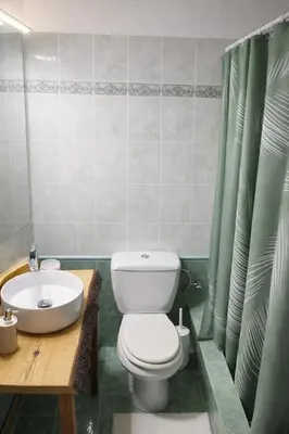 a bathroom with a toilet and a sink at Cozy apartment in Peania (near Airport) in Paianía