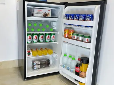 an open refrigerator filled with drinks and drinks at Our little 1 in Athens