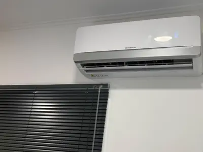 a air conditioner in a room with a ceiling at Our little 1 in Athens