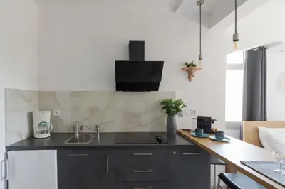 a kitchen with a sink and a counter at Nereid Apartment in Athens
