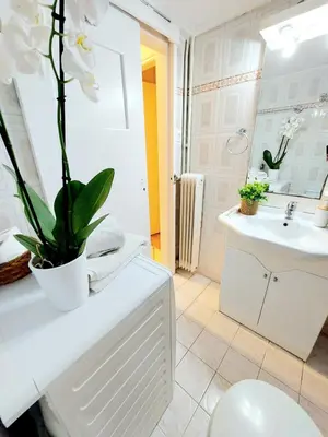a bathroom with a toilet and a sink at Lovely equipped apartment in Kallithea Athens in Athens