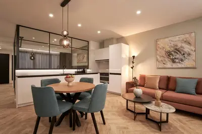 a living room with a table and a couch at Hestia - Dimitressa 4 in Athens