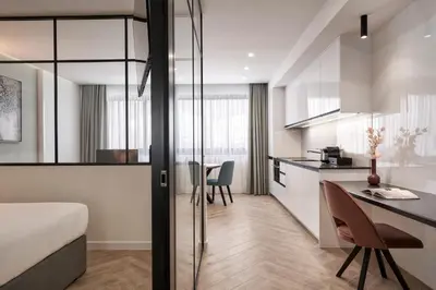 a kitchen and living room with a bed and a table at Hestia - Dimitressa 4 in Athens