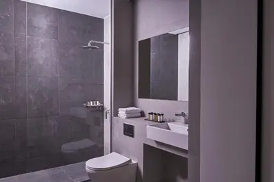 a bathroom with a toilet and a sink and a shower at Hestia - Dimitressa 4 in Athens
