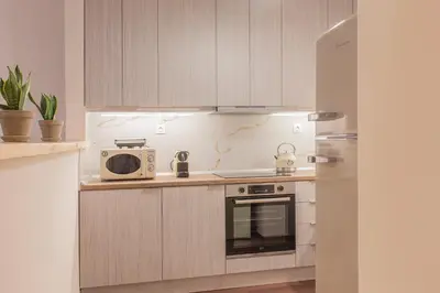 a kitchen with a microwave oven and a stove at Luxury Apartment with Jacuzzi Close to Acropolis - Living Stone Zircon in Athens