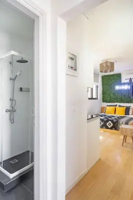 a white room with a shower and a bedroom at Downtown 22sqm Green Nest King-Size Bed in Athens