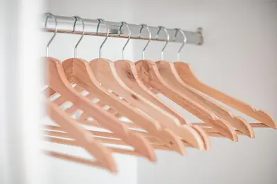 a bunch of wooden utensils hanging on a rack at Athena B&B in Athens