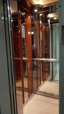 a row of glass doors in a building at Parthenon and Syntagma square view apartment in Athens