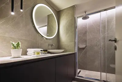 a bathroom with a sink and a shower at Acropolis Panorama Residence in Athens