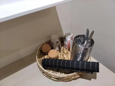a basket filled with utensils on a table at Kerameikos residence in Athens