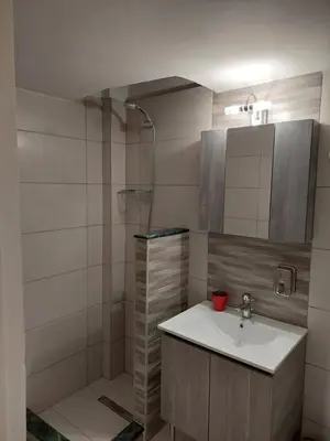 a bathroom with a sink and a shower at Kerameikos residence in Athens