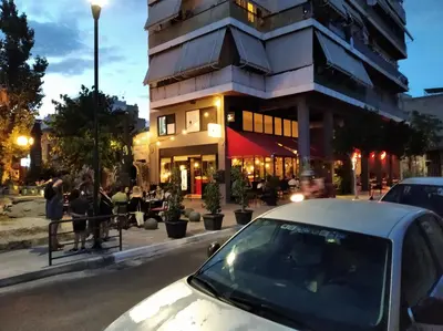 a white car parked in front of a building at Kerameikos residence in Athens