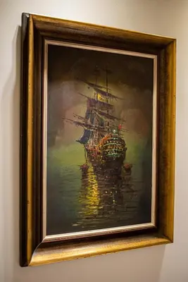 a painting of a ship in the water at Royal Apartment in Athens