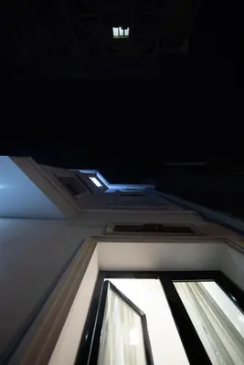 a window on top of a building with a roof at Royal Apartment in Athens