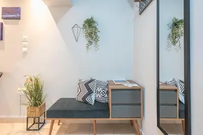 a room with a bench with plants on the wall at The Boutique Studio by CloudKeys in Athens