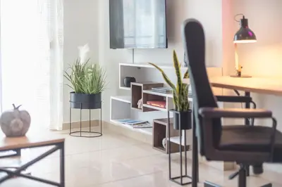 a living room with a desk and a chair at Elegant Home with Balcony by CloudKeys in Athens