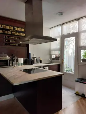 a kitchen with a large island with a counter top at Comfy penthouse in the center of Athens in Athens