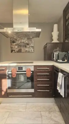 a kitchen with a stainless steel oven in a kitchen at Comfy penthouse in the center of Athens in Athens