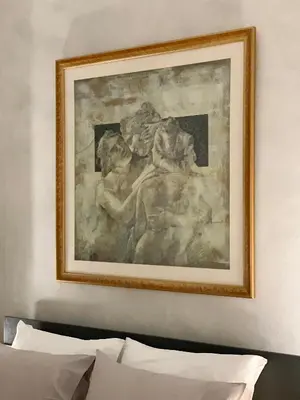a painting on a wall above a bed at Cozy and Chic apartment in the Center, 5 min Subway in Athens