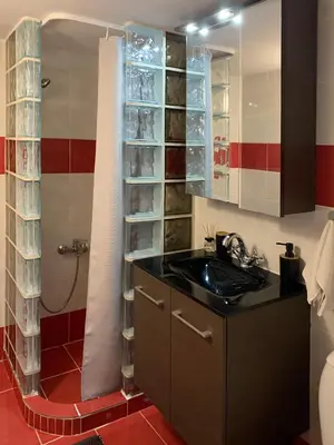 a bathroom with a sink and a shower at Cozy and Chic apartment in the Center, 5 min Subway in Athens