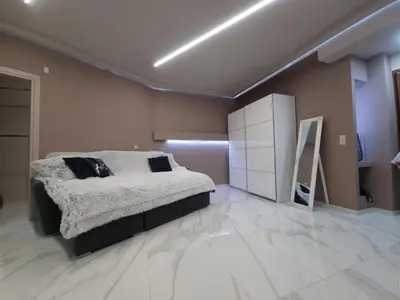 a bedroom with a bed and a mirror in it at CENTRAL in Athens