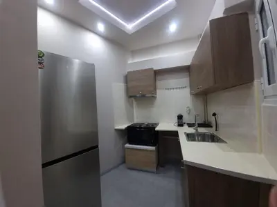 a small kitchen with a sink and a refrigerator at CENTRAL in Athens