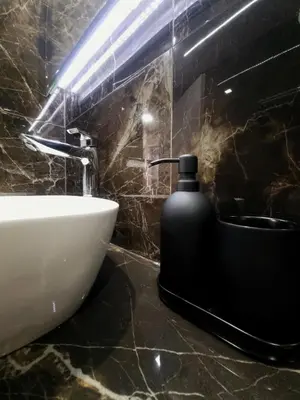 a bathroom with a sink and a soap dispenser at CENTRAL in Athens