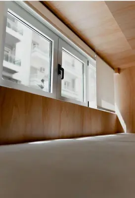 an empty room with two windows in a building at Luxury Studio in the heart of Kolonaki in Athens